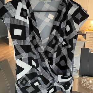 Beautiful patterned sleeveless blouse with faux wrap